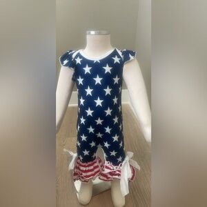 Stars and stripes.  One piece with ruffle bottoms.